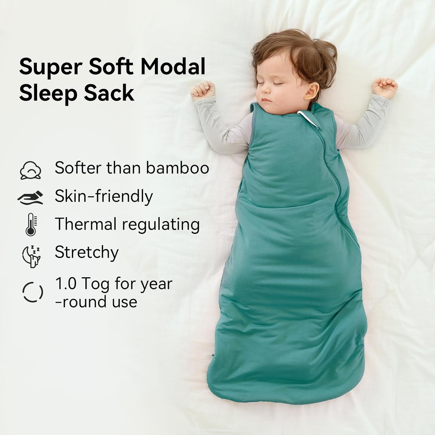 Peaceful baby sleeping in a BubblePanda Emerald Silky Modal sleep sack showing its buttery-soft and breathable fabric texture