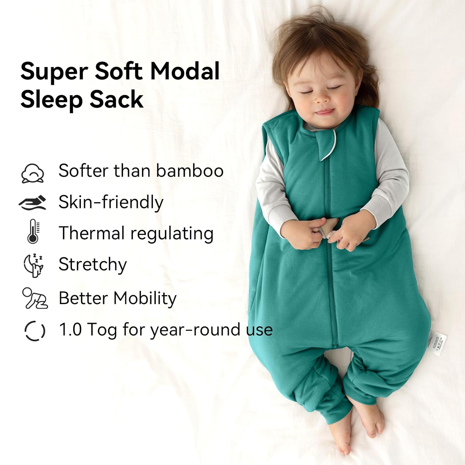 Peaceful toddler sleeping in a BubblePanda Emerald Silky Modal walker sack showing its buttery-soft and skin-friendly texture