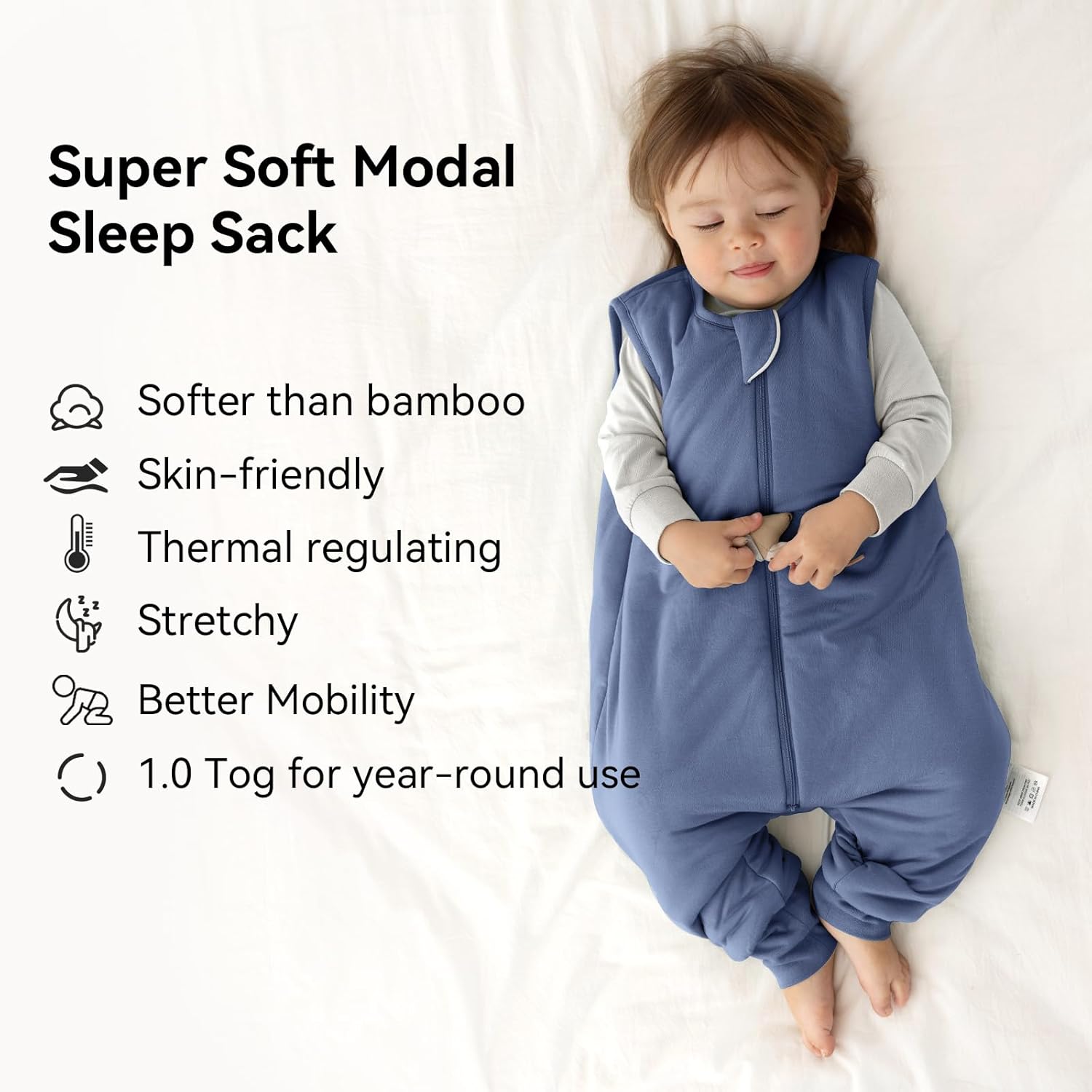 Peaceful toddler sleeping in a BubblePanda Navy Silky Modal walker Sack showing its buttery-soft and skin-friendly texture