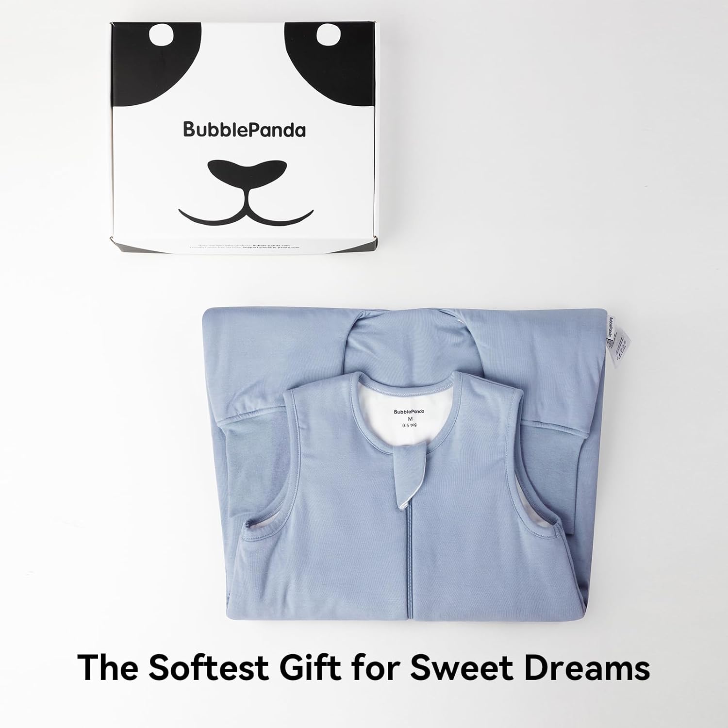 Baby sleeping peacefully in BubblePanda Slate 0.5 TOG bamboo sleep sack in a modern nursery